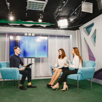 Tv host on talk show with two women guests