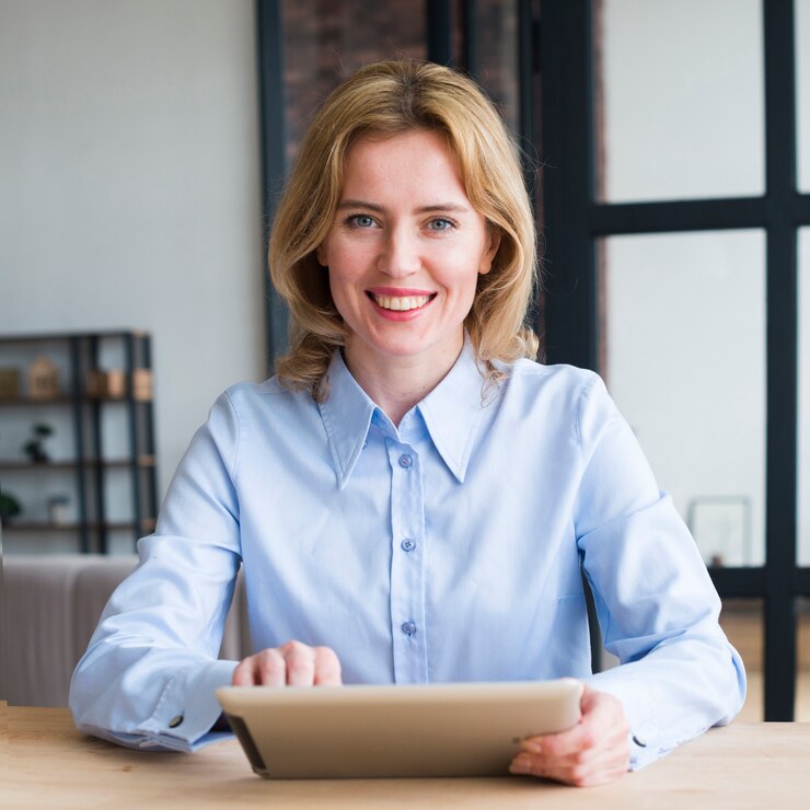 joyful-business-woman-using-tablet-table_23-2148095762