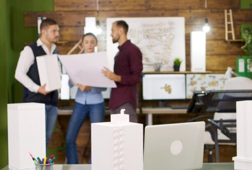 midsection-woman-using-digital-tablet-while-standing-office_1048944-24179522