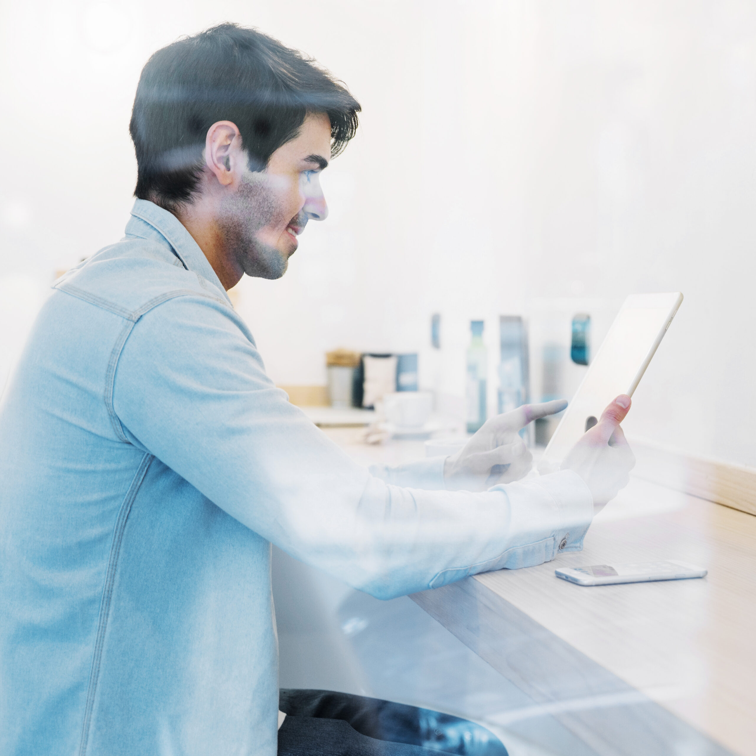 smiling-man-using-tablet